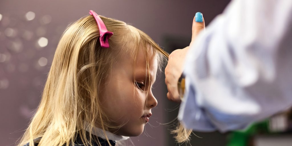 Barber female make fashionable hairstyle for little blond girl child in barbershop - FR Hair & Beauty| Pennant Hills Barber female make fashionable hairstyle for little blond girl child in barbershop