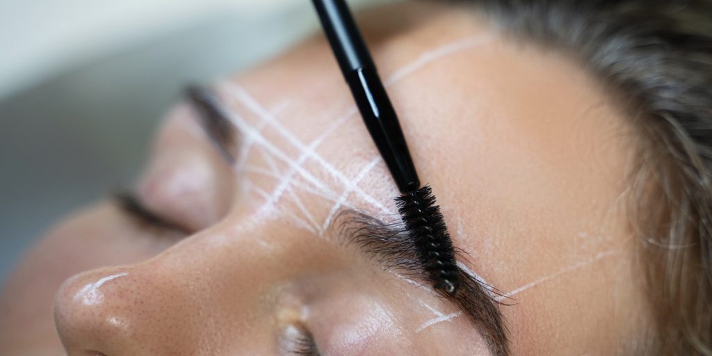 Woman during professional eyebrow mapping procedure - FR Hair & Beauty| Pennant Hills Woman during professional eyebrow mapping procedure