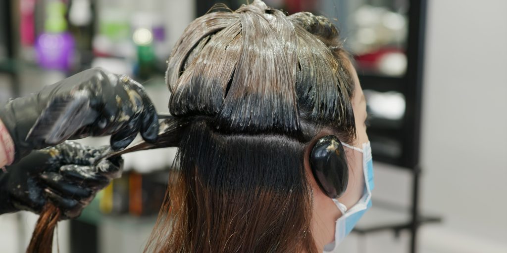 Woman dye hair color at beauty salon - FR Hair & Beauty| Pennant Hills Woman dye hair color at beauty salon